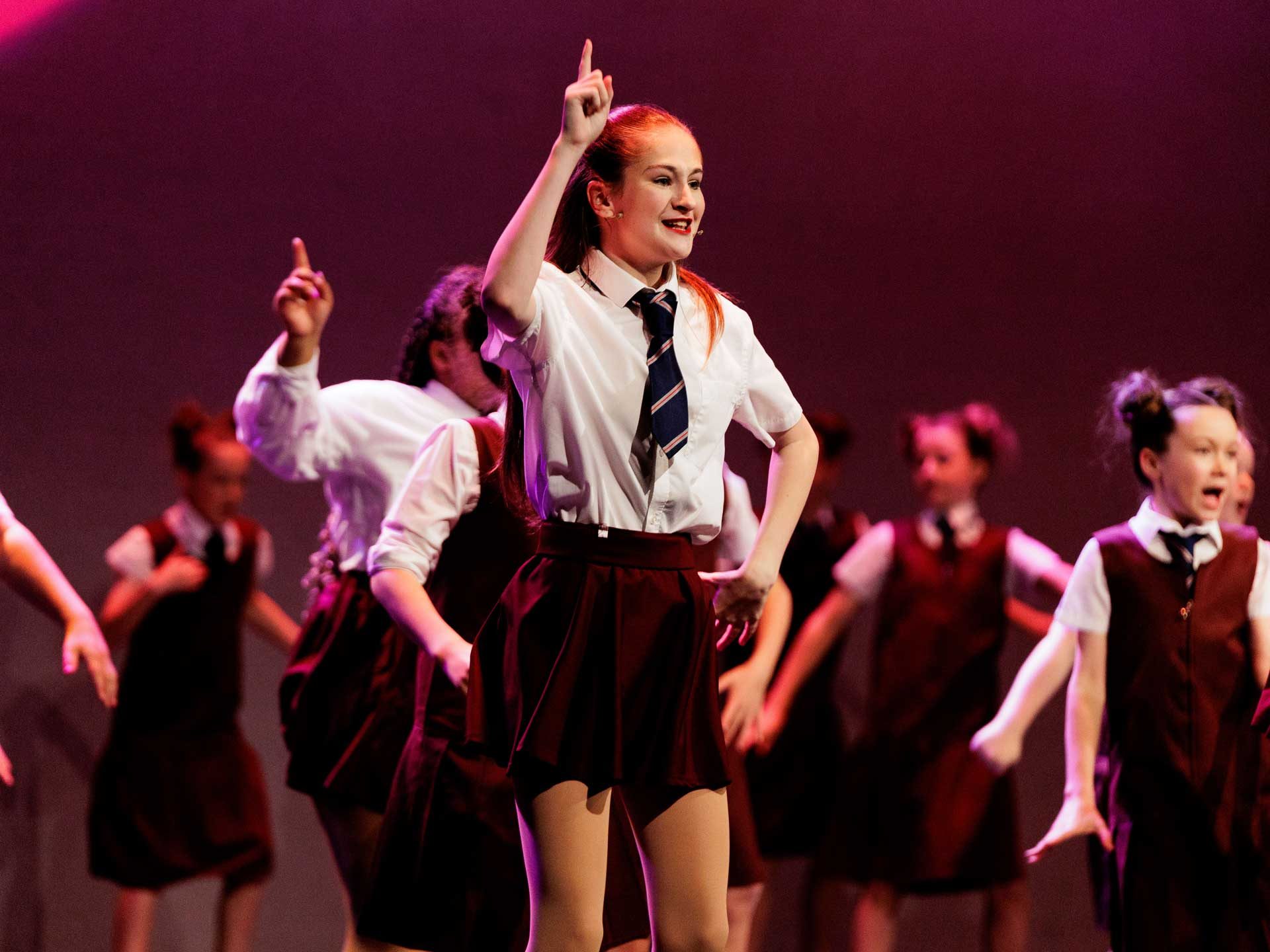 Audience view of a live performing arts showcase